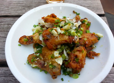The GreenHouse Tavern signature dishes Devils on Horseback
Crispy Chicken Wings
Frites